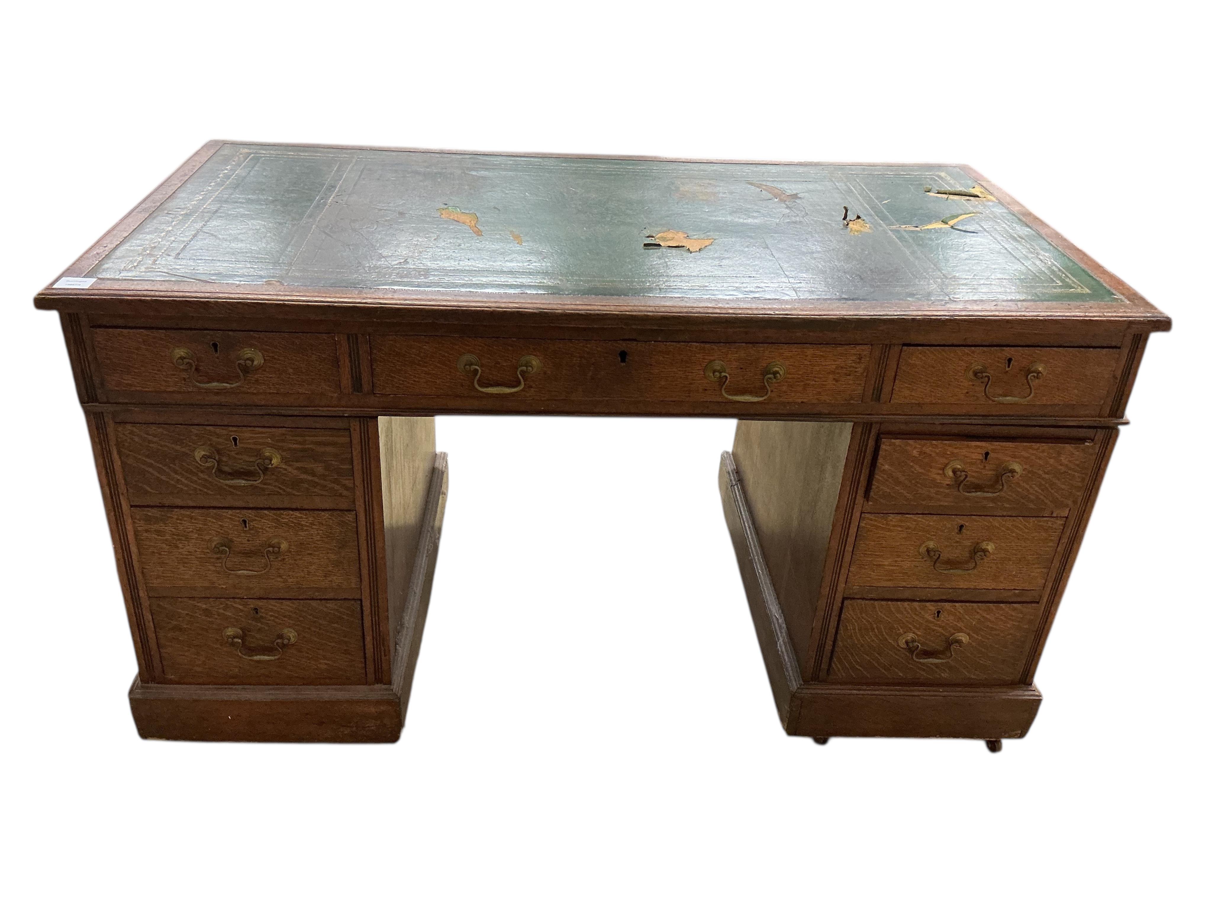 A Victorian oak pedestal desk, width 136cm, depth 72cm, height 75cm